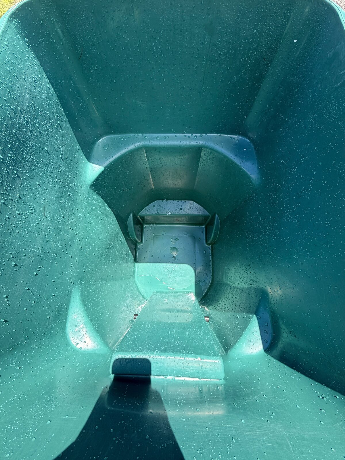 Clean green trash bin after professional cleaning